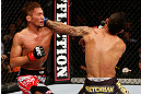 MACAU, MACAU - NOVEMBER 10:  (L-R) Yasuhiro Urushitani punches John Lineker during their flyweight bout at the UFC Macao event inside CotaiArena on November 10, 2012 in Macau, Macau.  (Photo by Josh Hedges/Zuffa LLC/Zuffa LLC via Getty Images)