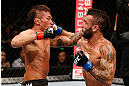 MACAU, MACAU - NOVEMBER 10:  (R-L) John Lineker and Yasuhiro Urushitani trade punches during their flyweight bout at the UFC Macao event inside CotaiArena on November 10, 2012 in Macau, Macau.  (Photo by Josh Hedges/Zuffa LLC/Zuffa LLC via Getty Images)