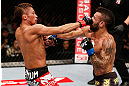 MACAU, MACAU - NOVEMBER 10:  (L-R) Yasuhiro Urushitani punches John Lineker during their flyweight bout at the UFC Macao event inside CotaiArena on November 10, 2012 in Macau, Macau.  (Photo by Josh Hedges/Zuffa LLC/Zuffa LLC via Getty Images)