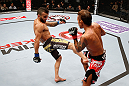 MACAU, MACAU - NOVEMBER 10: (L-R) John Lineker kicks Yasuhiro Urushitani during their flyweight bout at the UFC Macao event inside CotaiArena on November 10, 2012 in Macau, Macau. (Photo by Josh Hedges/Zuffa LLC/Zuffa LLC via Getty Images)
