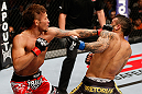 MACAU, MACAU - NOVEMBER 10:  (L-R) Yasuhiro Urushitani punches John Lineker during their flyweight bout at the UFC Macao event inside CotaiArena on November 10, 2012 in Macau, Macau.  (Photo by Josh Hedges/Zuffa LLC/Zuffa LLC via Getty Images)