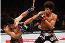 MACAU, MACAU - NOVEMBER 10:  (R-L) Alex Caceres punches Motonobu Tezuka during their bantamweight bout at the UFC Macao event inside CotaiArena on November 10, 2012 in Macau, Macau.  (Photo by Josh Hedges/Zuffa LLC/Zuffa LLC via Getty Images)