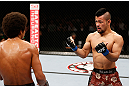 MACAU, MACAU - NOVEMBER 10:  (R-L) Motonobu Tezuka taunts Alex Caceres during their bantamweight bout at the UFC Macao event inside CotaiArena on November 10, 2012 in Macau, Macau.  (Photo by Josh Hedges/Zuffa LLC/Zuffa LLC via Getty Images)