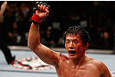 MACAU, MACAU - NOVEMBER 10:  Takeya Mizugaki reacts after defeating Jeff Hougland during their bantamweight bout at the UFC Macao event inside CotaiArena on November 10, 2012 in Macau, Macau.  (Photo by Josh Hedges/Zuffa LLC/Zuffa LLC via Getty Images)