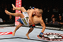 MACAU, MACAU - NOVEMBER 10: (L-R) Tiequan Zhang takes down Jon Tuck during their lightweight bout at the UFC Macao event inside CotaiArena on November 10, 2012 in Macau, Macau. (Photo by Josh Hedges/Zuffa LLC/Zuffa LLC via Getty Images)