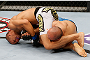 MACAU, MACAU - NOVEMBER 10: (L-R) Jon Tuck attempts an arm bar submission against Tiequan Zhang during their lightweight bout at the UFC Macao event inside CotaiArena on November 10, 2012 in Macau, Macau. (Photo by Josh Hedges/Zuffa LLC/Zuffa LLC via Getty Images)
