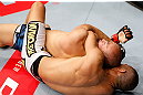 MACAU, MACAU - NOVEMBER 10: (R-L) Jon Tuck attempts a rear choke submission against Tiequan Zhang during their lightweight bout at the UFC Macao event inside CotaiArena on November 10, 2012 in Macau, Macau. (Photo by Josh Hedges/Zuffa LLC/Zuffa LLC via Getty Images)
