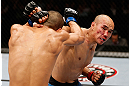 MACAU, MACAU - NOVEMBER 10: (R-L) Tiequan Zhang punches Jon Tuck during their lightweight bout at the UFC Macao event inside CotaiArena on November 10, 2012 in Macau, Macau. (Photo by Josh Hedges/Zuffa LLC/Zuffa LLC via Getty Images)