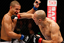 MACAU, MACAU - NOVEMBER 10: (R-L) Tiequan Zhang punches Jon Tuck during their lightweight bout at the UFC Macao event inside CotaiArena on November 10, 2012 in Macau, Macau. (Photo by Josh Hedges/Zuffa LLC/Zuffa LLC via Getty Images)
