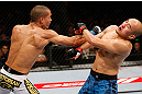 MACAU, MACAU - NOVEMBER 10: (L-R) Jon Tuck punches Tiequan Zhang during their lightweight bout at the UFC Macao event inside CotaiArena on November 10, 2012 in Macau, Macau. (Photo by Josh Hedges/Zuffa LLC/Zuffa LLC via Getty Images)
