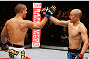 MACAU, MACAU - NOVEMBER 10: (L-R) Jon Tuck and Tiequan Zhang congratulate each other after their lightweight bout at the UFC Macao event inside CotaiArena on November 10, 2012 in Macau, Macau. (Photo by Josh Hedges/Zuffa LLC/Zuffa LLC via Getty Images)