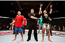 MACAU, MACAU - NOVEMBER 10: Jon Tuck (R) reacts after defeating Tiequan Zhang during their lightweight bout at the UFC Macao event inside CotaiArena on November 10, 2012 in Macau, Macau. (Photo by Josh Hedges/Zuffa LLC/Zuffa LLC via Getty Images)