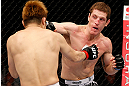 MACAU, MACAU - NOVEMBER 10: (R-L) Mac Danzig punches Takanori Gomi during their lightweight bout at the UFC Macao event inside CotaiArena on November 10, 2012 in Macau, Macau. (Photo by Josh Hedges/Zuffa LLC/Zuffa LLC via Getty Images)