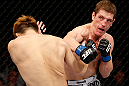 MACAU, MACAU - NOVEMBER 10: (R-L) Mac Danzig punches Takanori Gomi during their lightweight bout at the UFC Macao event inside CotaiArena on November 10, 2012 in Macau, Macau. (Photo by Josh Hedges/Zuffa LLC/Zuffa LLC via Getty Images)