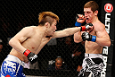 MACAU, MACAU - NOVEMBER 10: (L-R) Takanori Gomi punches Mac Danzig during their lightweight bout at the UFC Macao event inside CotaiArena on November 10, 2012 in Macau, Macau. (Photo by Josh Hedges/Zuffa LLC/Zuffa LLC via Getty Images)