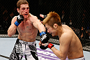 MACAU, MACAU - NOVEMBER 10: (L-R) Mac Danzig punches Takanori Gomi during their lightweight bout at the UFC Macao event inside CotaiArena on November 10, 2012 in Macau, Macau. (Photo by Josh Hedges/Zuffa LLC/Zuffa LLC via Getty Images)