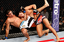 MACAU, MACAU - NOVEMBER 10: (R-L) Dong Hyun Kim attempts to take down Paulo Thiago during their welterweight bout at the UFC Macao event inside CotaiArena on November 10, 2012 in Macau, Macau. (Photo by Josh Hedges/Zuffa LLC/Zuffa LLC via Getty Images)