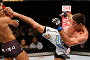 MACAU, MACAU - NOVEMBER 10: (R-L) Paulo Thiago kicks Dong Hyun Kim during their welterweight bout at the UFC Macao event inside CotaiArena on November 10, 2012 in Macau, Macau. (Photo by Josh Hedges/Zuffa LLC/Zuffa LLC via Getty Images)