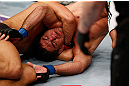 MACAU, MACAU - NOVEMBER 10: (R-L) Paulo Thiago fights off a choke attempt by Dong Hyun Kim during their welterweight bout at the UFC Macao event inside CotaiArena on November 10, 2012 in Macau, Macau. (Photo by Josh Hedges/Zuffa LLC/Zuffa LLC via Getty Images)