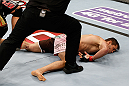 MACAU, MACAU - NOVEMBER 10: Rich Franklin lays on the canvas after being knocked out by Cung Le during their middleweight bout at the UFC Macao event inside CotaiArena on November 10, 2012 in Macau, Macau. (Photo by Josh Hedges/Zuffa LLC/Zuffa LLC via Getty Images)