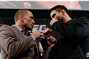 MONTREAL, CANADA - NOVEMBER 14:  (L-R) Opponents Georges St-Pierre and Carlos Condit face off during the final pre-fight press conference ahead of UFC 154 at New City Gas on November 14, 2012 in Montreal, Quebec, Canada.  (Photo by Josh Hedges/Zuffa LLC/Zuffa LLC via Getty Images)