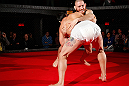 MONTREAL, CANADA - NOVEMBER 15:  Tom Lawlor performs a sumo workout routine for media and fans during an open training session ahead of UFC 154 at New City Gas on November 15, 2012 in Montreal, Quebec, Canada.  (Photo by Josh Hedges/Zuffa LLC/Zuffa LLC via Getty Images)