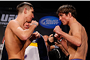 MONTREAL, CANADA - NOVEMBER 16:  (L-R) Opponents Steven Siler and Darren Elkins face off during the official UFC 154 weigh in at New City Gas on November 16, 2012 in Montreal, Quebec, Canada.  (Photo by Josh Hedges/Zuffa LLC/Zuffa LLC via Getty Images)