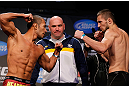 MONTREAL, CANADA - NOVEMBER 16:  (L-R) Opponents Ivan Menjivar and Azamat Gashimov face off during the official UFC 154 weigh in at New City Gas on November 16, 2012 in Montreal, Quebec, Canada.  (Photo by Josh Hedges/Zuffa LLC/Zuffa LLC via Getty Images)