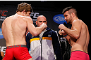 MONTREAL, CANADA - NOVEMBER 16:  (L-R) Opponents Matthew Riddle and John Maguire face off during the official UFC 154 weigh in at New City Gas on November 16, 2012 in Montreal, Quebec, Canada.  (Photo by Josh Hedges/Zuffa LLC/Zuffa LLC via Getty Images)