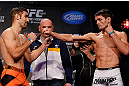 MONTREAL, CANADA - NOVEMBER 16:  (L-R) Opponents Antonio Carvalho and Rodrigo Damm face off during the official UFC 154 weigh in at New City Gas on November 16, 2012 in Montreal, Quebec, Canada.  (Photo by Josh Hedges/Zuffa LLC/Zuffa LLC via Getty Images)