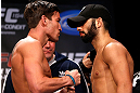 MONTREAL, CANADA - NOVEMBER 16:  (L-R) Opponents Sam Stout and John Makdessi face off during the official UFC 154 weigh in at New City Gas on November 16, 2012 in Montreal, Quebec, Canada.  (Photo by Josh Hedges/Zuffa LLC/Zuffa LLC via Getty Images)