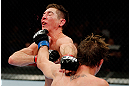 MONTREAL, QC - NOVEMBER 17:  Darren Elkins (R) connects on a punch to the face of Steven Siler in their featherweight bout during UFC 154 on November 17, 2012  at the Bell Centre in Montreal, Canada.  (Photo by Josh Hedges/Zuffa LLC/Zuffa LLC via Getty Images)