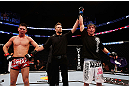 MONTREAL, QC - NOVEMBER 17:  Darren Elkins (R) celebrates after defeating Steven Siler in their featherweight bout during UFC 154 on November 17, 2012  at the Bell Centre in Montreal, Canada.  (Photo by Josh Hedges/Zuffa LLC/Zuffa LLC via Getty Images)
