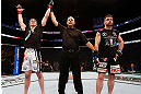 MONTREAL, QC - NOVEMBER 17:  Matthew Riddle (L) celebrates after being declared the winner by decision against John Maguire in their welterweight bout during UFC 154 on November 17, 2012  at the Bell Centre in Montreal, Canada.  (Photo by Josh Hedges/Zuffa LLC/Zuffa LLC via Getty Images)