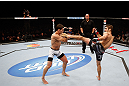 MONTREAL, QC - NOVEMBER 17:  Rodrigo Damm (L) attemps to block the kick of Antonio Carvalho in their featherweight bout during UFC 154 on November 17, 2012  at the Bell Centre in Montreal, Canada.  (Photo by Josh Hedges/Zuffa LLC/Zuffa LLC via Getty Images)