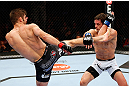 MONTREAL, QC - NOVEMBER 17:  Rodrigo Damm (R) attemps to block the kick of Antonio Carvalho in their featherweight bout during UFC 154 on November 17, 2012  at the Bell Centre in Montreal, Canada.  (Photo by Josh Hedges/Zuffa LLC/Zuffa LLC via Getty Images)