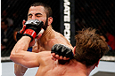 MONTREAL, QC - NOVEMBER 17:  Sam Stout (R) connects on a punch against John Makdessi in their lightweight bout during UFC 154 on November 17, 2012  at the Bell Centre in Montreal, Canada.  (Photo by Josh Hedges/Zuffa LLC/Zuffa LLC via Getty Images)
