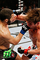 MONTREAL, QC - NOVEMBER 17:  John Makdessi (L) connects on a punch against Sam Stout in their lightweight bout during UFC 154 on November 17, 2012  at the Bell Centre in Montreal, Canada.  (Photo by Josh Hedges/Zuffa LLC/Zuffa LLC via Getty Images)