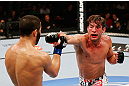 MONTREAL, QC - NOVEMBER 17:  Sam Stout (R) throws a punch against John Makdessi in their lightweight bout during UFC 154 on November 17, 2012  at the Bell Centre in Montreal, Canada.  (Photo by Josh Hedges/Zuffa LLC/Zuffa LLC via Getty Images)