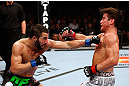 MONTREAL, QC - NOVEMBER 17:  John Makdessi (L) throws a punch against Sam Stout in their lightweight bout during UFC 154 on November 17, 2012  at the Bell Centre in Montreal, Canada.  (Photo by Josh Hedges/Zuffa LLC/Zuffa LLC via Getty Images)