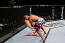 MONTREAL, QC - NOVEMBER 17:  Cyrille Diabate takes down Chad Griggs in their light heavyweight bout during UFC 154 on November 17, 2012  at the Bell Centre in Montreal, Canada.  (Photo by Josh Hedges/Zuffa LLC/Zuffa LLC via Getty Images)