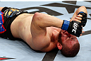 MONTREAL, QC - NOVEMBER 17:  Chad Griggs reacts after tapping out after being put in a choke hold by Cyrille Diabate in their light heavyweight bout during UFC 154 on November 17, 2012  at the Bell Centre in Montreal, Canada.  (Photo by Josh Hedges/Zuffa LLC/Zuffa LLC via Getty Images)
