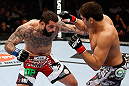 MONTREAL, QC - NOVEMBER 17:  Alessio Sakara (L) throws a punch against Patrick Cote in their middleweight bout during UFC 154 on November 17, 2012  at the Bell Centre in Montreal, Canada.  (Photo by Josh Hedges/Zuffa LLC/Zuffa LLC via Getty Images)