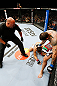 MONTREAL, QC - NOVEMBER 17:  Alessio Sakara (R) punches Patrick Cote in the back of the head as referee Dan Miragliotta looks on during their middleweight bout during UFC 154 on November 17, 2012  at the Bell Centre in Montreal, Canada. Sakara was later disqualified for the illegal punches.  (Photo by Josh Hedges/Zuffa LLC/Zuffa LLC via Getty Images)