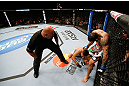 MONTREAL, QC - NOVEMBER 17:  Alessio Sakara punches Patrick Cote in the back of the head as referee Dan Miragliotta looks on during their middleweight bout during UFC 154 on November 17, 2012  at the Bell Centre in Montreal, Canada. Sakara was later disqualified for the illegal punches. (Photo by Josh Hedges/Zuffa LLC/Zuffa LLC via Getty Images)