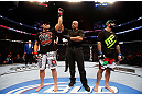 MONTREAL, QC - NOVEMBER 17:  Referee Dan Miragliotta declares Patrick Cote the winner after the disqualification of Alessio Sakara because of punches he threw to the back of the head during their middleweight bout during UFC 154 on November 17, 2012  at the Bell Centre in Montreal, Canada. Sakara was later disqualified for the illegal punches.  (Photo by Josh Hedges/Zuffa LLC/Zuffa LLC via Getty Images)
