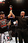 MONTREAL, QC - NOVEMBER 17:  Referee Dan Miragliotta declares Patrick Cote the winner after the disqualification of Alessio Sakara because of punches he threw to the back of the head during their middleweight bout during UFC 154 on November 17, 2012  at the Bell Centre in Montreal, Canada. Sakara was later disqualified for the illegal punches.  (Photo by Josh Hedges/Zuffa LLC/Zuffa LLC via Getty Images)