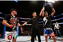 MONTREAL, QC - NOVEMBER 17:  Pablo Garza (R)) celebrates after defeating Mark Hominick in their featherweight bout during UFC 154 on November 17, 2012  at the Bell Centre in Montreal, Canada.  (Photo by Josh Hedges/Zuffa LLC/Zuffa LLC via Getty Images)