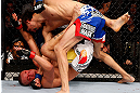 MONTREAL, QC - NOVEMBER 17:  Pablo Garza (R) grapples against Mark Hominick in their featherweight bout during UFC 154 on November 17, 2012  at the Bell Centre in Montreal, Canada.  (Photo by Josh Hedges/Zuffa LLC/Zuffa LLC via Getty Images)