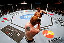 MONTREAL, QC - NOVEMBER 17:  Rafael dos Anjos attempts to land a kick against Mark Bocek in their lightweight bout during UFC 154 on November 17, 2012  at the Bell Centre in Montreal, Canada.  (Photo by Josh Hedges/Zuffa LLC/Zuffa LLC via Getty Images)